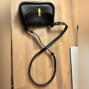 Black mini purse. Gold hardware. Never used.